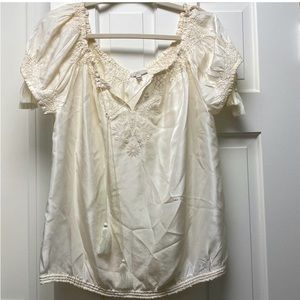 Joie cream short sleeve blouse with beautiful embroidered detail and tassels.